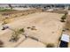 Aerial view of property includes spacious land and horse facilities at 49853 W Jean Dr, Maricopa, AZ 85139