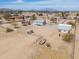 Aerial view showcasing the property and surrounding desert landscape with distant mountains at 49853 W Jean Dr, Maricopa, AZ 85139
