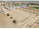 Expansive aerial view of the fenced property with stalls and plenty of open space at 49853 W Jean Dr, Maricopa, AZ 85139