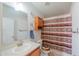 The bathroom features a single sink vanity, toilet, and shower with patterned curtain at 49853 W Jean Dr, Maricopa, AZ 85139