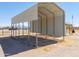 A metal carport stands ready to protect vehicles from the elements, ensuring they remain in top condition at 49853 W Jean Dr, Maricopa, AZ 85139