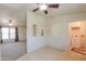 Dining room featuring tile floors, built-in shelves, and a view of the living area at 49853 W Jean Dr, Maricopa, AZ 85139