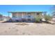 Charming single-story home with a covered porch and desert landscaping at 49853 W Jean Dr, Maricopa, AZ 85139