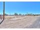 Gravel drive and white fence highlight property's charm at 49853 W Jean Dr, Maricopa, AZ 85139