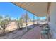 Covered patio area with tile flooring and outdoor seating at 49853 W Jean Dr, Maricopa, AZ 85139