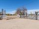 Gated property entrance with white fencing, providing security and rustic charm for the beautiful rural residence at 49853 W Jean Dr, Maricopa, AZ 85139