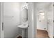 Bathroom featuring a sink and vanity and an entrance to the laundry room at 5057 E Dragoon Ave, Mesa, AZ 85206