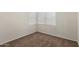 Cozy bedroom with neutral carpet, a bright window with white blinds, and ample outlets at 5057 E Dragoon Ave, Mesa, AZ 85206