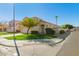Charming home with desert landscaping and a well-manicured front lawn on a corner lot at 5057 E Dragoon Ave, Mesa, AZ 85206