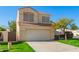 Beautiful two-story home featuring a wide driveway and manicured front lawn at 5057 E Dragoon Ave, Mesa, AZ 85206