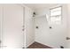 Utility room with vinyl flooring, shelf, fire extinguisher, small window, and hookups at 5057 E Dragoon Ave, Mesa, AZ 85206