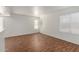 Bright living room with beautiful hardwood floors and plenty of natural light at 5057 E Dragoon Ave, Mesa, AZ 85206