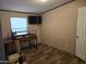 Bedroom features wood-look floors and one window at 52150 W Cardinal S Rd, Maricopa, AZ 85139