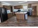 Spacious kitchen featuring a center island, modern appliances, and ample cabinet space at 52150 W Cardinal S Rd, Maricopa, AZ 85139