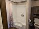 Shower with white showerhead and patterned curtain at 52150 W Cardinal S Rd, Maricopa, AZ 85139