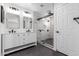 Modern bathroom featuring a dual vanity, sleek fixtures, and a frameless glass shower at 5325 W Desert Hills Dr, Glendale, AZ 85304
