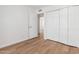 Inviting bedroom with hardwood floors and a closet with bi-fold doors at 5325 W Desert Hills Dr, Glendale, AZ 85304