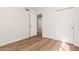 Clean bedroom with hardwood floors and a double door closet at 5325 W Desert Hills Dr, Glendale, AZ 85304