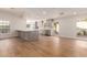 Bright kitchen with stainless steel appliances, stylish backsplash, and center island with quartz countertops at 5325 W Desert Hills Dr, Glendale, AZ 85304