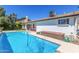 Refreshing private pool in a well-maintained backyard featuring pristine turquoise water and ample deck space for lounging at 5325 W Desert Hills Dr, Glendale, AZ 85304