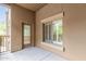 Balcony featuring neutral stucco and a sliding window providing community views at 5450 E Deer Valley Dr # 2003, Phoenix, AZ 85054
