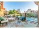 Stunning outdoor patio with elegant furniture, glass railings, and views of the community pool and residences at 5450 E Deer Valley Dr # 2003, Phoenix, AZ 85054