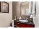 Well-maintained bathroom with updated sink and fixtures plus decorative giraffe accents at 5622 W Cavedale Dr, Phoenix, AZ 85083