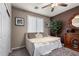 Cozy bedroom with a plush daybed, fan, and neutral decor for a relaxing retreat at 5622 W Cavedale Dr, Phoenix, AZ 85083