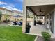 Expansive covered patio with ceiling fans, offering a comfortable space for outdoor dining and relaxation with pool view at 5622 W Cavedale Dr, Phoenix, AZ 85083