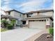 Charming two-story home featuring a large garage, desert landscaping and a paved driveway at 5622 W Cavedale Dr, Phoenix, AZ 85083