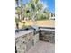 Outdoor kitchen features a stone-accented grill and cooking space for entertaining at 5622 W Cavedale Dr, Phoenix, AZ 85083
