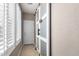 Bright hallway with natural light streaming through shuttered windows and stylish sliding doors at 5622 W Cavedale Dr, Phoenix, AZ 85083