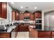 Gourmet kitchen with stainless steel appliances and a spacious center island at 5622 W Cavedale Dr, Phoenix, AZ 85083