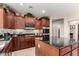 Modern kitchen with dark granite countertops and stainless steel appliances at 5622 W Cavedale Dr, Phoenix, AZ 85083
