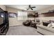 Carpeted Living room featuring TV with comfortable sofa and chair at 5622 W Cavedale Dr, Phoenix, AZ 85083