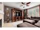 Cozy living room featuring a large entertainment center and comfortable seating area at 5622 W Cavedale Dr, Phoenix, AZ 85083