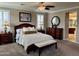 Comfortable main bedroom with neutral tones, carpet flooring, and a ceiling fan at 5622 W Cavedale Dr, Phoenix, AZ 85083