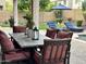 Elegant outdoor dining area with a large table and comfortable seating, perfect for entertaining guests by the pool at 5622 W Cavedale Dr, Phoenix, AZ 85083