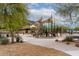 Inviting community playground with shade structures and modern play equipment for outdoor activities at 5622 W Cavedale Dr, Phoenix, AZ 85083