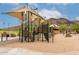 Playground featuring climbing structures with shade structures, providing a safe and enjoyable play area at 5622 W Cavedale Dr, Phoenix, AZ 85083