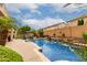 Stunning pool and patio area with lush landscaping, offering a perfect blend of relaxation and entertainment at 5622 W Cavedale Dr, Phoenix, AZ 85083