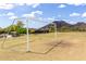 Community soccer field with goals, surrounded by lush green grass and trees, providing space for outdoor sports at 5622 W Cavedale Dr, Phoenix, AZ 85083