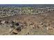 Panoramic aerial view of a sprawling residential area with green spaces and natural landscape at 6372 W Hill Ln, Glendale, AZ 85310