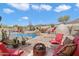 Inviting backyard with a custom pool, built in fireplace, seating and desert landscaping at 6372 W Hill Ln, Glendale, AZ 85310