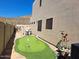 Backyard with a putting green, desert landscaping, and mountain views at 6372 W Hill Ln, Glendale, AZ 85310