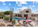 Expansive backyard featuring a pool, lounge chairs, desert landscaping, and mountain views at 6372 W Hill Ln, Glendale, AZ 85310