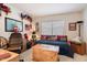 Comfortable bedroom with Americana decor, complete with a custom-painted wooden chest at 6372 W Hill Ln, Glendale, AZ 85310