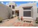 Desert home entrance featuring low-water landscaping, stone walkway, and decorative accents at 6372 W Hill Ln, Glendale, AZ 85310