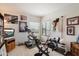 Bright home gym with treadmill, exercise bike, and weight station for at-home fitness at 6372 W Hill Ln, Glendale, AZ 85310