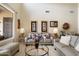 Relaxing living room with neutral tones, stylish decor, and a comfortable sofa with decorative pillows at 6372 W Hill Ln, Glendale, AZ 85310